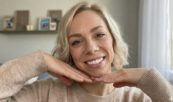 Author smiling confidently showing white teeth